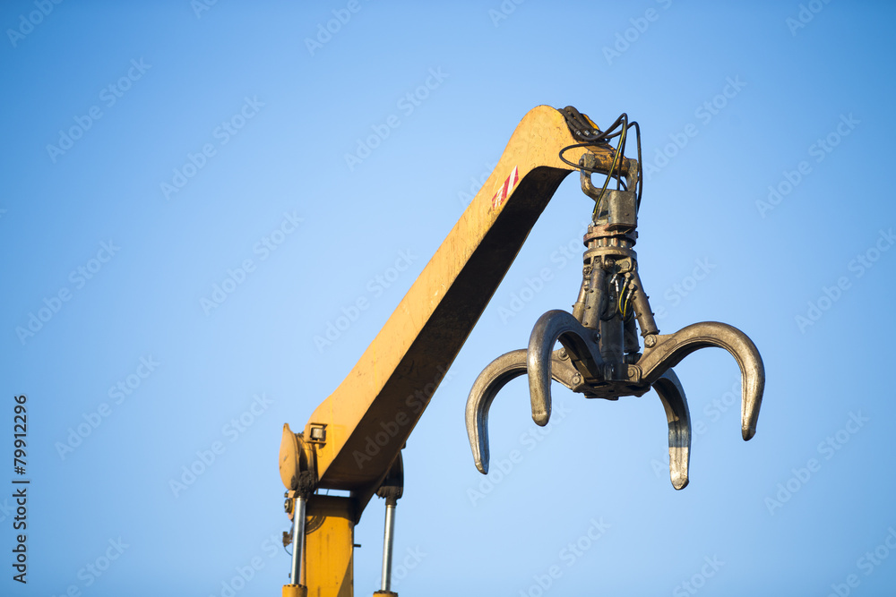 Close-up of a crane for recycling metallic waste Close-up of a crane for recycling metallic waste
