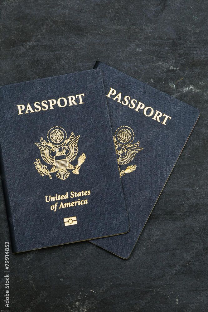 Two US passports on black background Two US passports on black background