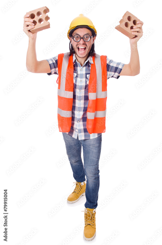 Funny young construction worker with broken brick isolated on Funny young construction worker with broken brick isolated on