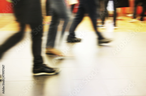 Abstract people are walking in the city. Motion blur. © ArtBackground