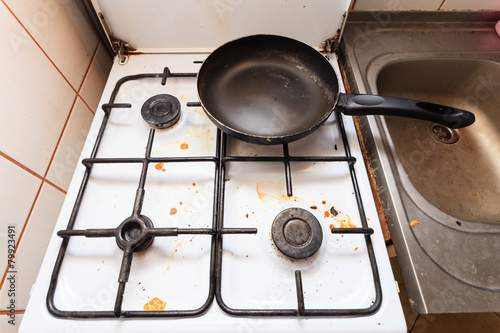 Fényképezés Dirty grubby gas stove in kitchen