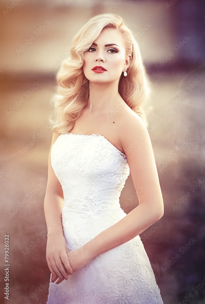 Beautiful bride blonde with stylish make-up in white dress Beautiful bride blonde with stylish make-up in white dress