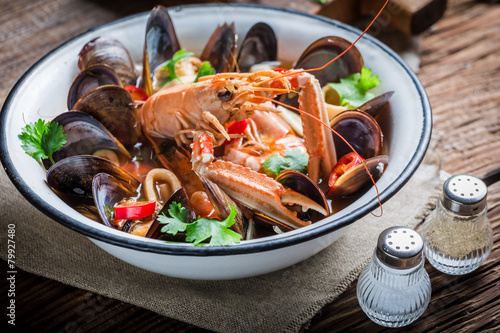 Tasty seafood soup with mussels and langoustines