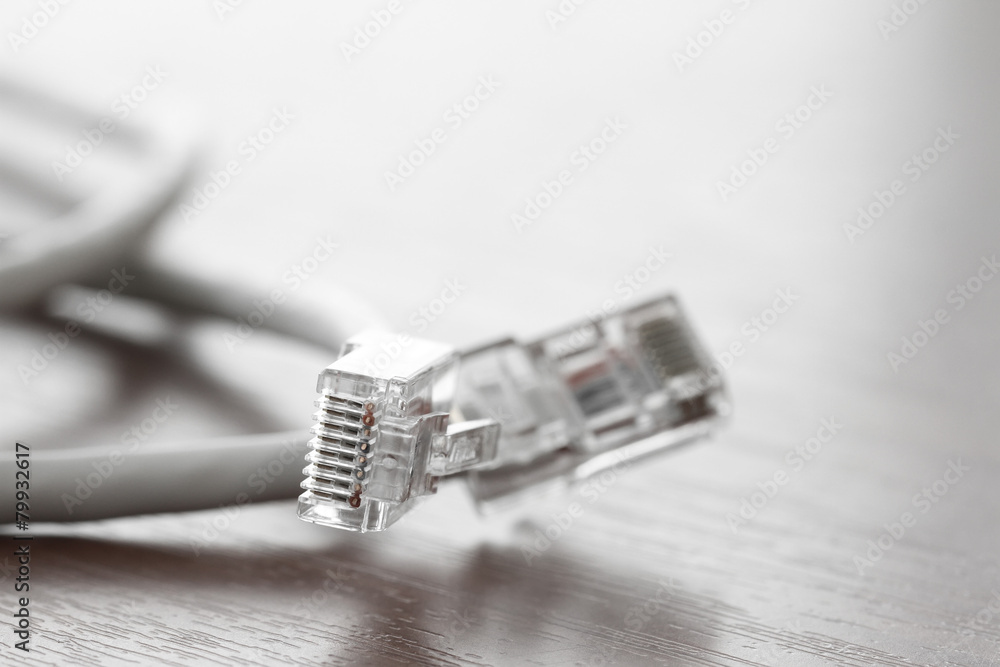 close up of RJ45 Plug Lan Network on wood desk close up of RJ45 Plug Lan Network on wood desk