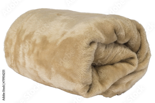 Fluffy, brown blanket rolled on a white background photo