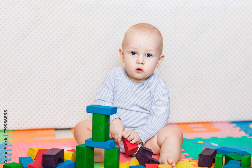 Cute little baby playing with colorful toys Cute little baby playing with colorful toys