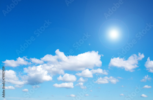 Sun on blue sky with lens flare