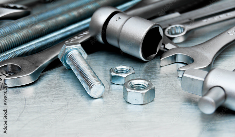 Metal tools and fixing elements on the scratched metal Metal tools and fixing elements on the scratched metal
