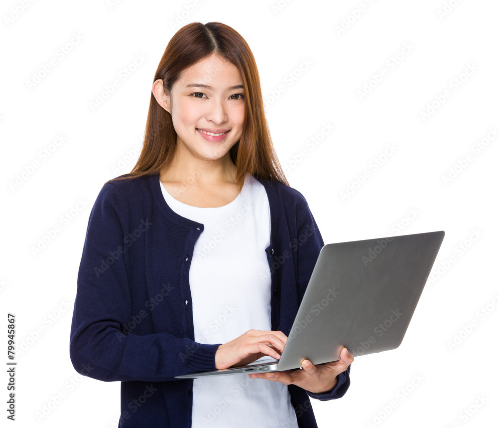 Attractive smiling young woman holding laptop computer Attractive smiling young woman holding laptop computer