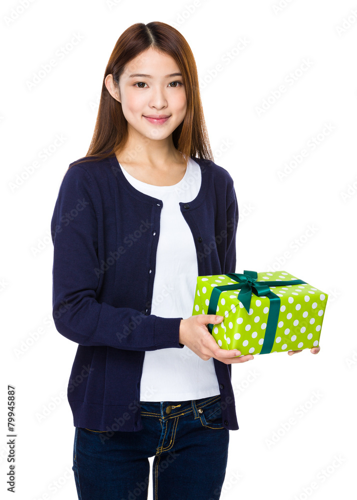 Beautiful girl holding a gift box isolated on white background