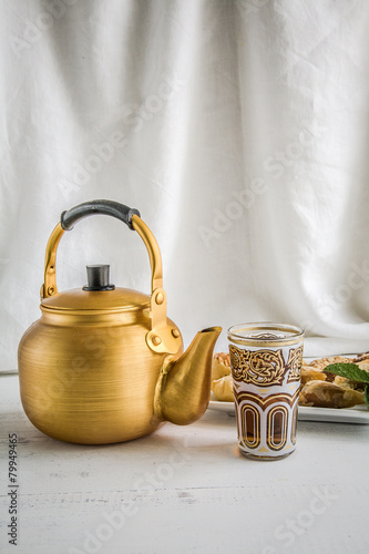 Arabic teapot on white wooden table