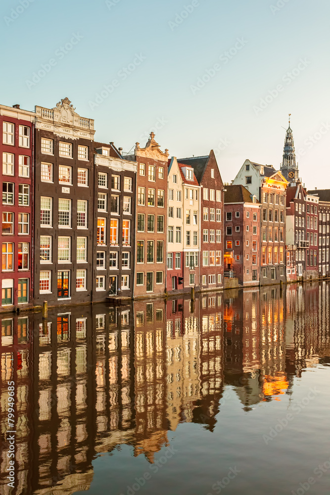 Naklejka premium Ancient canal houses in the Dutch capital city Amsterdam