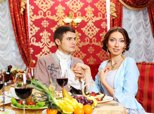 man in a historic jacket and girl in vintage dress  photo