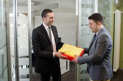 Businessman giving documents