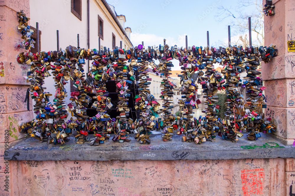 padlocks locked luck on a metal fenceon Prague, Czech Republic