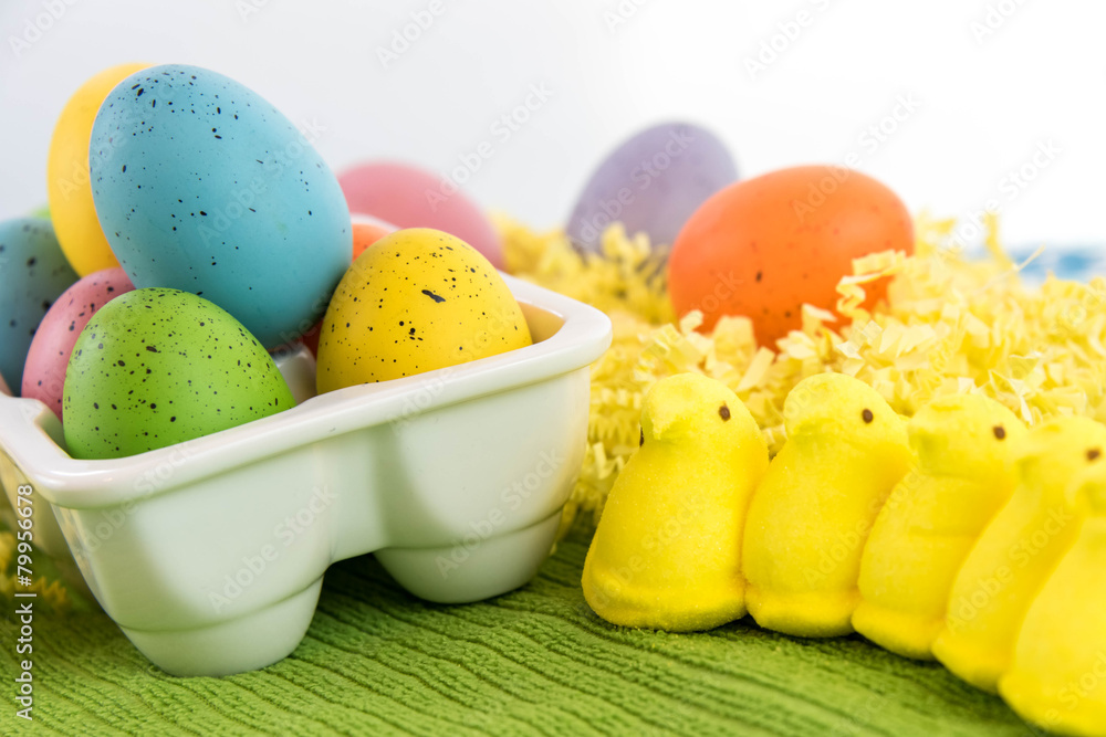 colored Easter eggs and yellow marsshmallow chick
