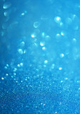 Abstract blurred photo of blue bokeh light burst and textures