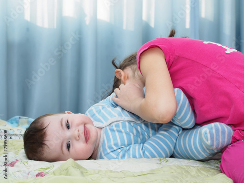 Portrait of caucasian children playing at home photo