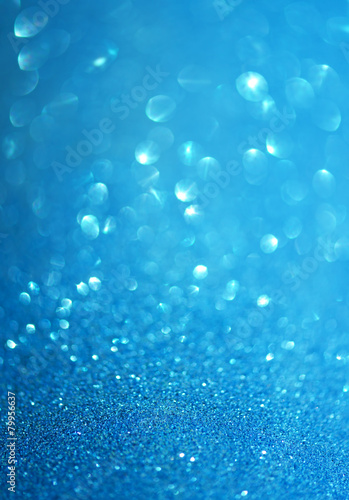 Abstract blurred photo of blue bokeh light burst and textures
