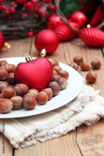 Christmas hearth with nuts on a white plate