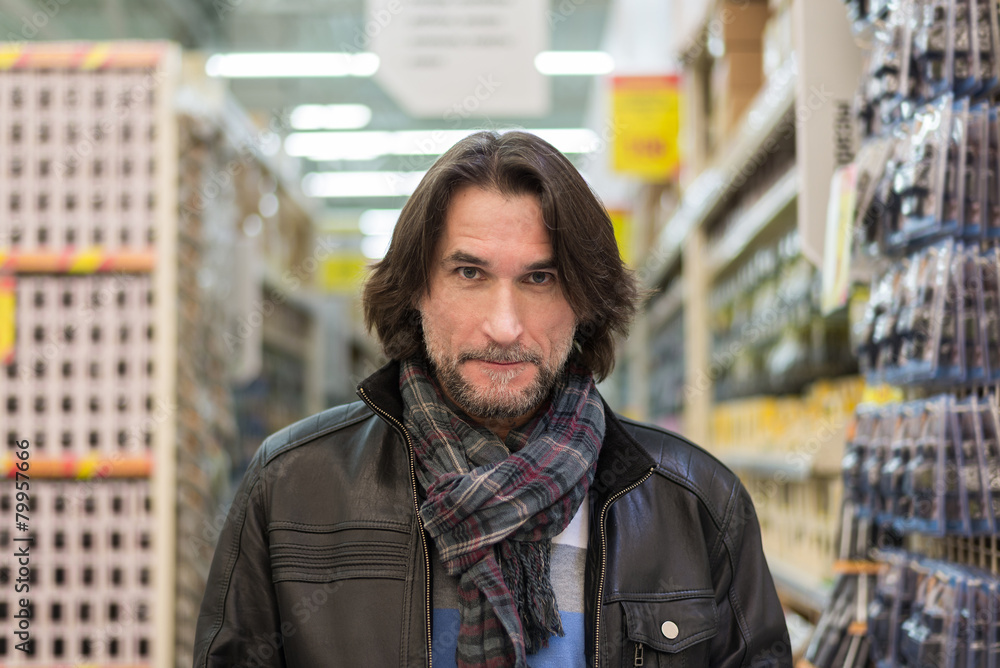 Portrait of middle-aged man in a store building materials Portrait of middle-aged man in a store building materials