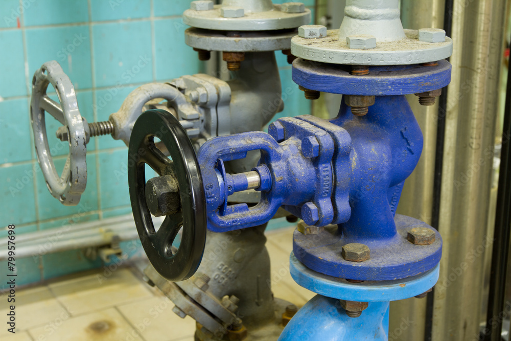 Pipes and faucet valves of heating system in a boiler room Pipes and faucet valves of heating system in a boiler room