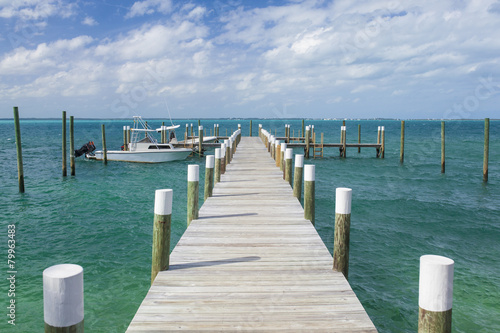 dock and boats in bahamas © Wollwerth Imagery