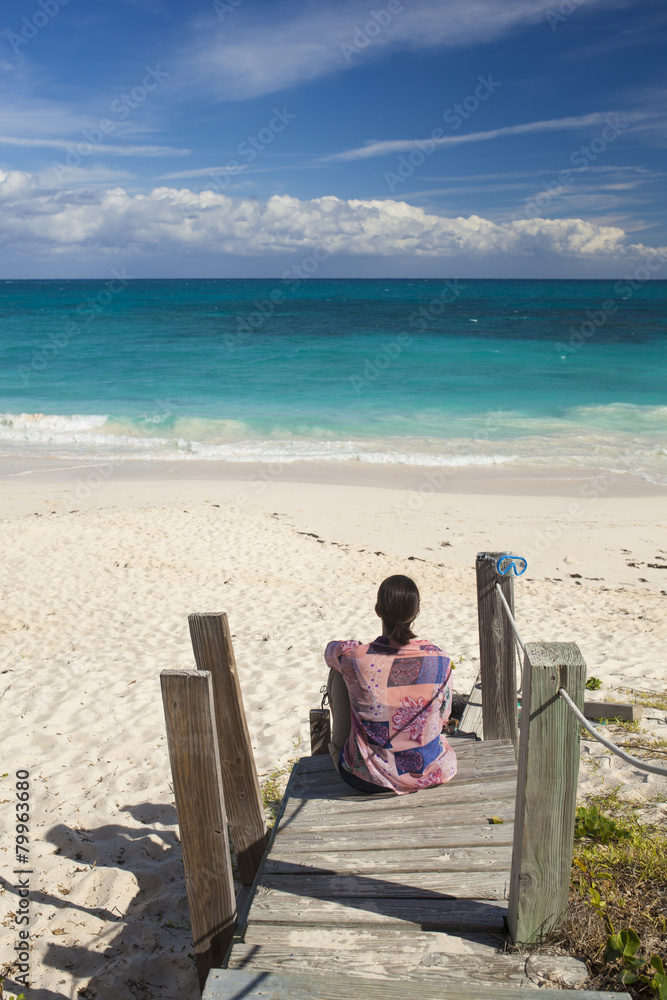 Woman looking over tropical beach