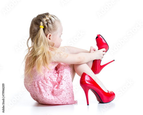 kid girl trying mummy's sho...