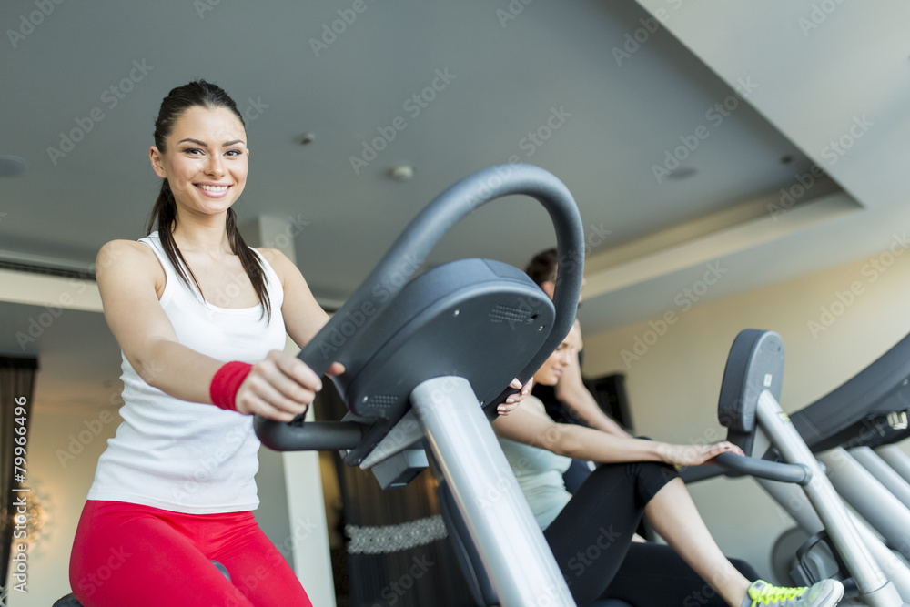 Fototapeta premium Young woman in the gym