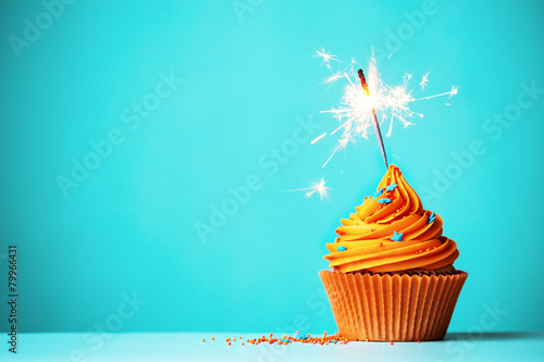 Orange cupcake with sparkler