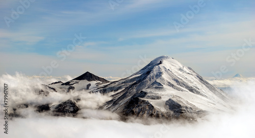 peaks of mountains above the clouds, Russia, Kamchatka