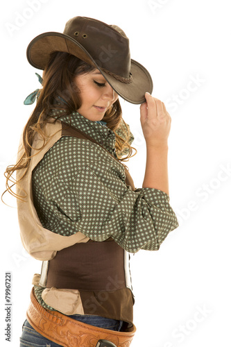 cowgirl with gun and holster touch hat look down