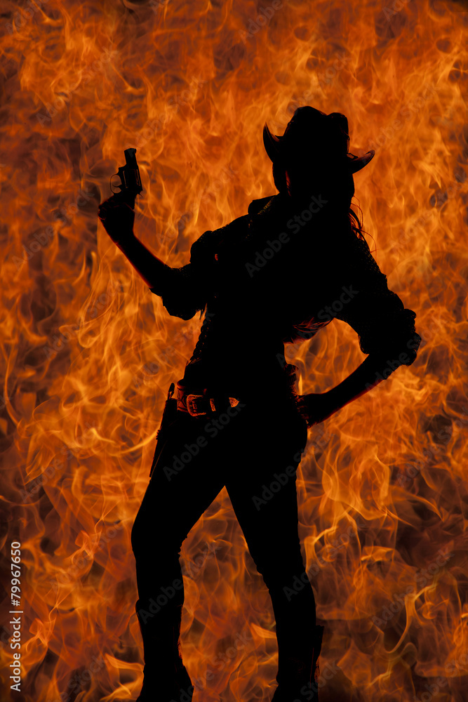 silhouette of cowgirl holding up gun hand on hip lean back silhouette of cowgirl holding up gun hand on hip lean back