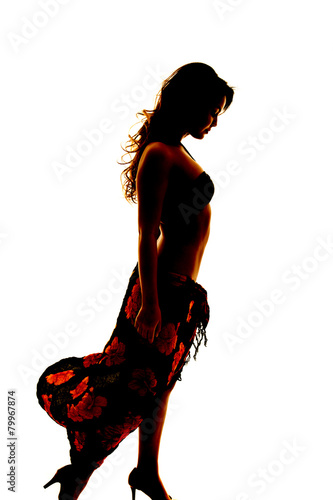 silhouette of woman in bikini and sarong side look down