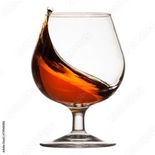 Splash of cognac in glass