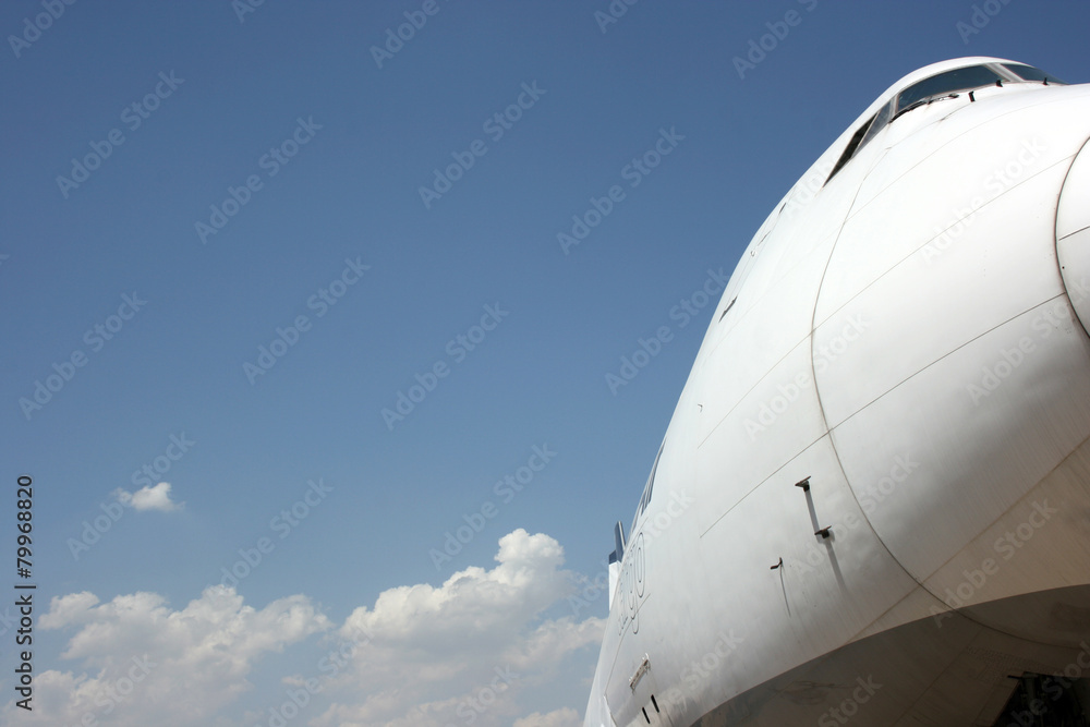 Fototapeta premium Boeing 747 Close Nose Side View with Blue Sky Background