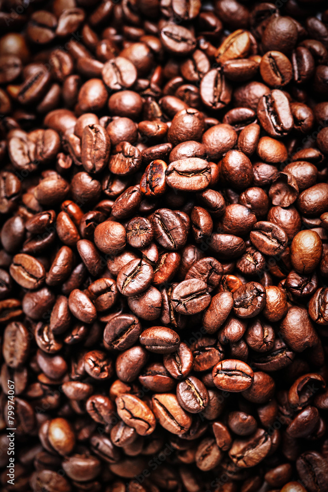 Naklejka premium Brown coffee beans. Roasted coffee beans for background and text