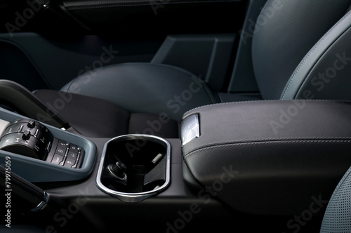 Auto interior detail. Leather armrest.