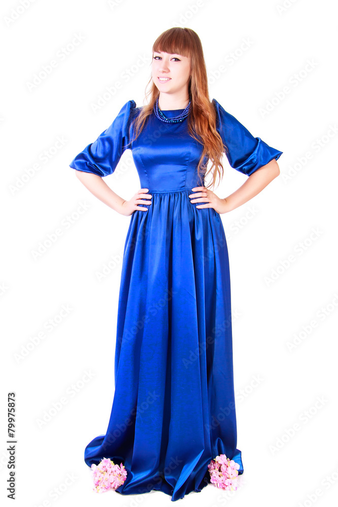 Young attractive woman in a long blue evening dress