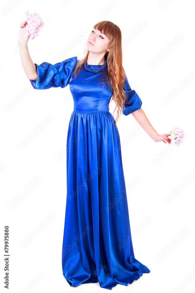 Young attractive woman in a long blue evening dress Young attractive woman in a long blue evening dress