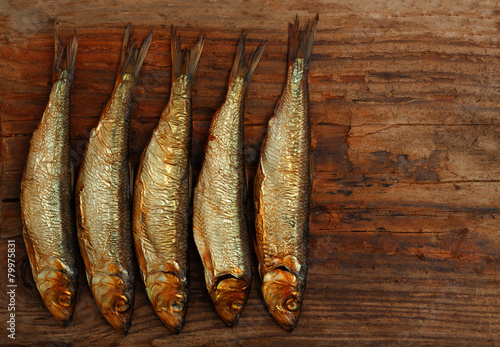 herring sprat fish smoked wooden table