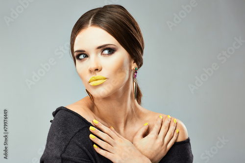 Beauty woman face portrait. Yellow lips.