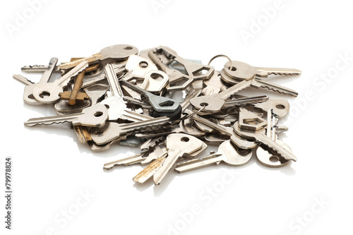 a bunch of different keys from the door on a white background