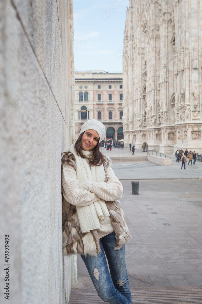 Beautiful young woman posing in the city streets Beautiful young woman posing in the city streets