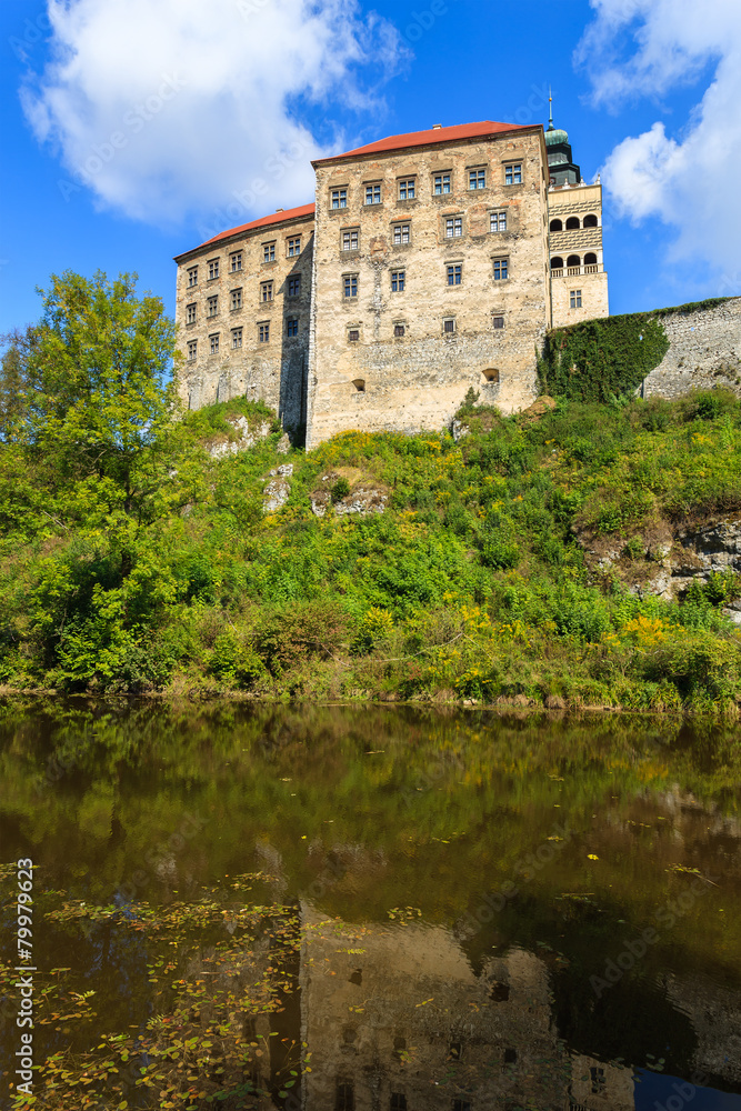 Beautiful Pieskowa Skala castle located by small lake, Poland