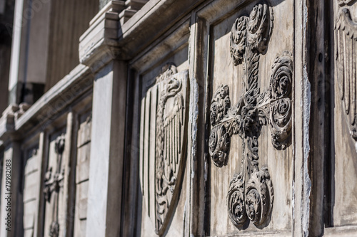 Decorative cross - architectural detail on facade of basilica photo
