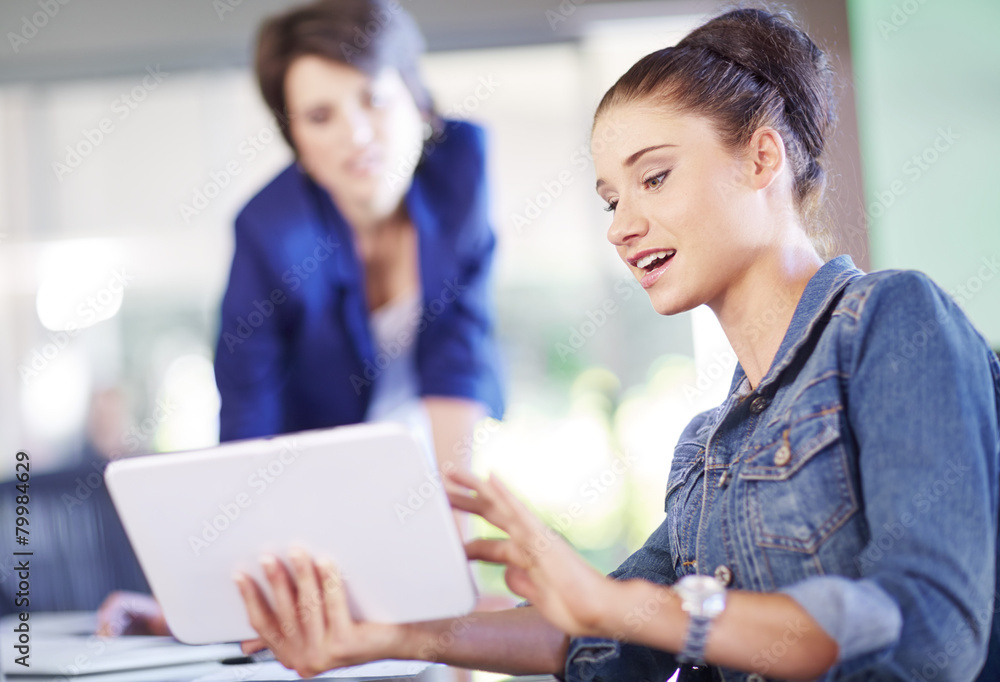 Female creative professionals with digital tablet Female creative professionals with digital tablet