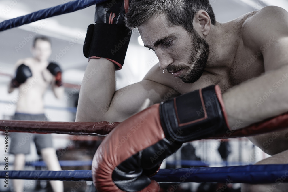 Boxer resting at the side of boxing ring Boxer resting at the side of boxing ring
