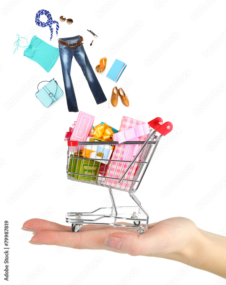 Goods falling into cart isolated on white Goods falling into cart isolated on white